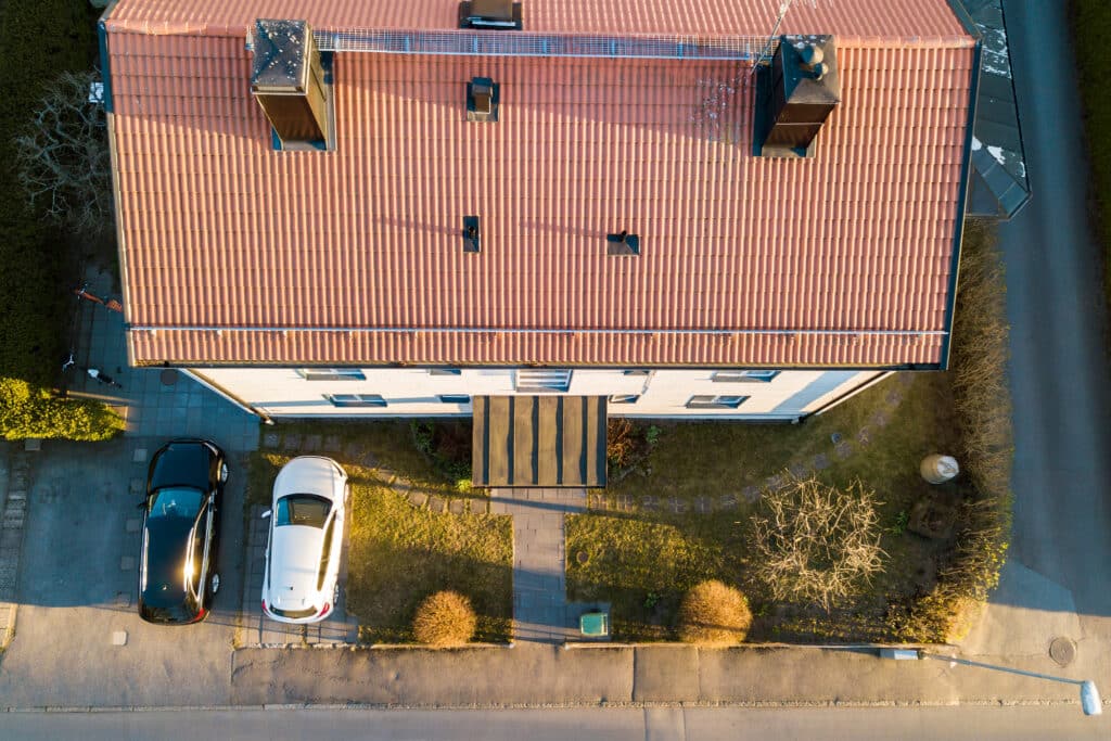 aerial view of residential houses with red roofs aerial view of residential houses with red roofs